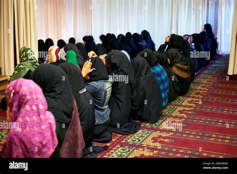 Coming together in worship. women worshipping in a mosque Stock Photo ...