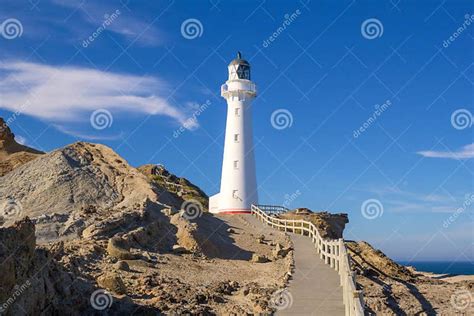 Walkway To Castlepoint Lighthouse In Morning Sunlight New Zealand