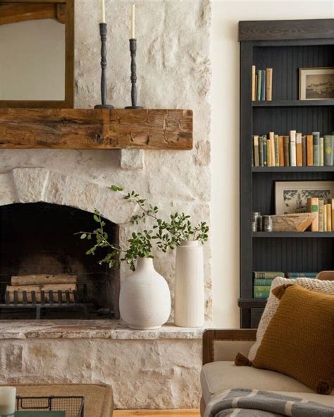 A Living Room Filled With Furniture And A Fire Place