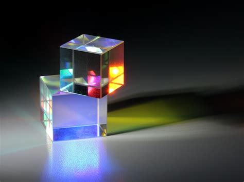 Premium Photo Two Bright Luminous Prism Cubes Refract Light In