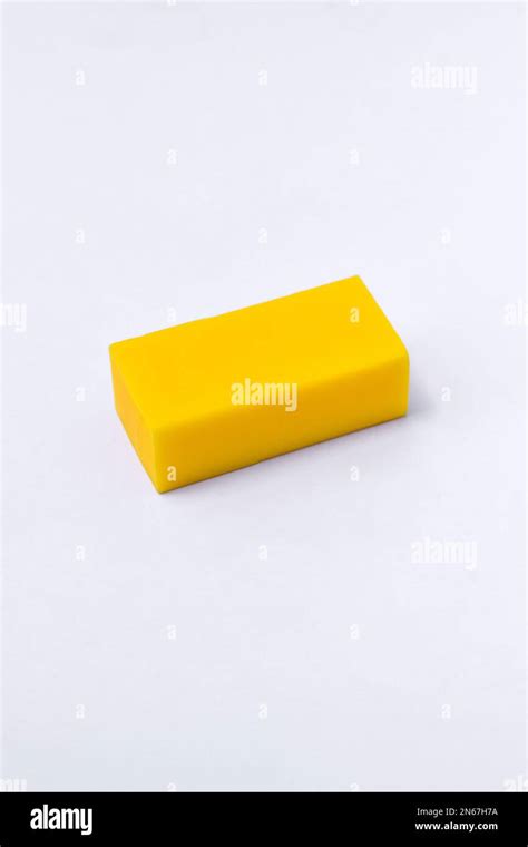 Yellow eraser isolated on white background Stock Photo - Alamy