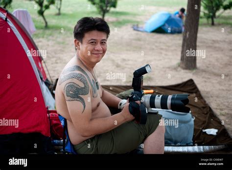Chaoyang Park Beijing Amateur Photographer With Snake Tattoo Sitting