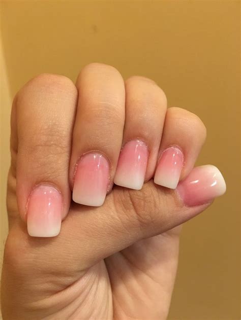 These are pink and white ombré nails White tip with white and pink