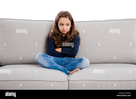 Little Girl Sitting On Couch