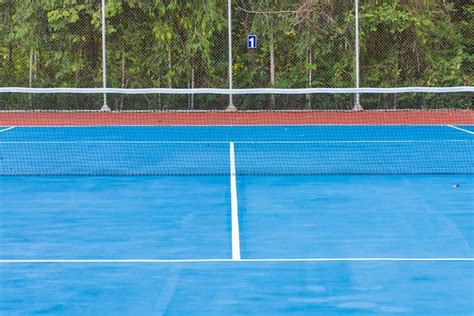 Premium Photo Net On Blue Tennis Court