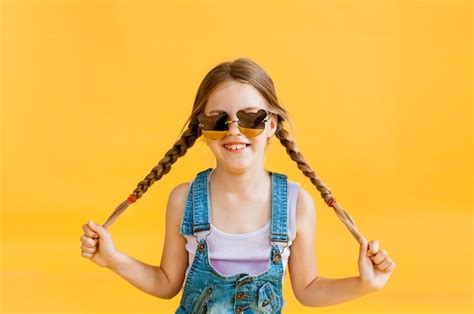 Premium Photo Little Cute Smiling Girl Standing Isolated Over Yellow