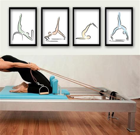 A Woman Is Doing Exercises On A Piyoma Mat In Front Of Three Framed