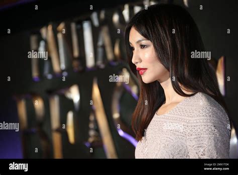 Gemma Chan Poses For Photographers Upon Arrival At The Premiere Of The