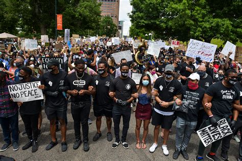 Denver Broncos Lead March Through The City After Head Coach Denies