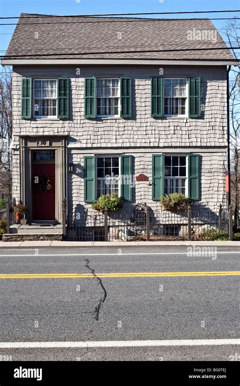 exterior gray shingle Federal style house dating from 1820 with green ...