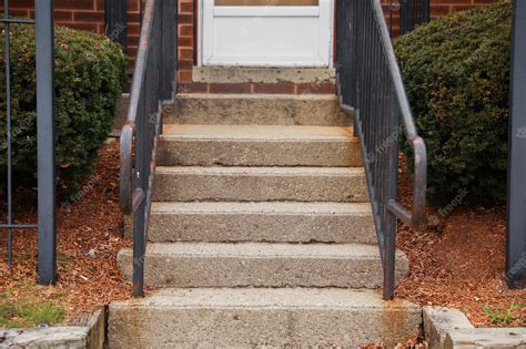 Premium Photo | A front porch with a metal railing and a black metal ...