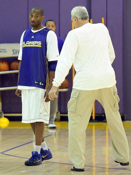 Kobe Bryant looks at Phil Jackson during practice.JPG