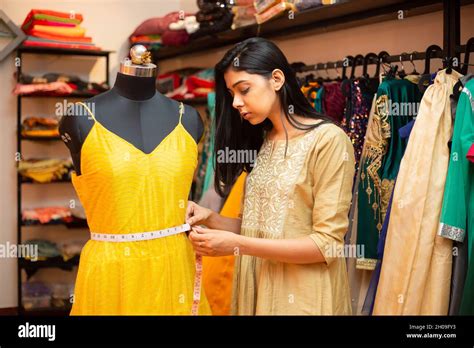 Young indian happy woman,tailor,fashion designer,dressmaker seamstress ...