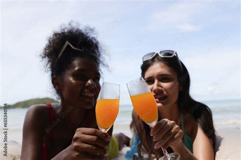 Happy Women With Bikini Sunbathing And Drinking Orange Juice On A Tropical Beach S Summer