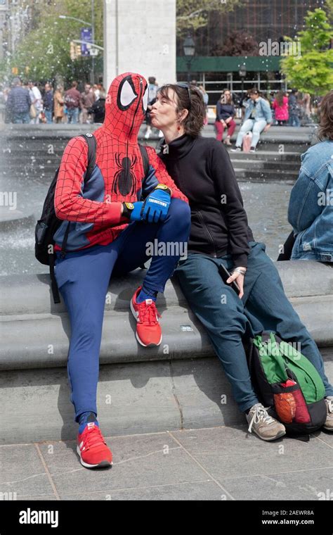 A funny photo of a Italian tourist kissing a Spiderman busker in ...