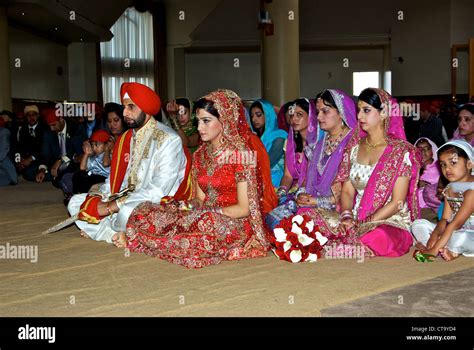 Traditional East Indian Wedding Groom Bright Red Turban Bride Red Sari