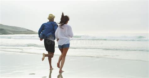 Beach Ocean And Happy Couple Holding Hands Running Or Bonding On Outdoor Journey On Island