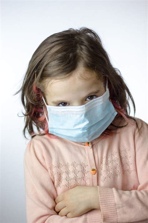 Little Kid Girl with the Mask on Face during Epidemy Stock Photo ...