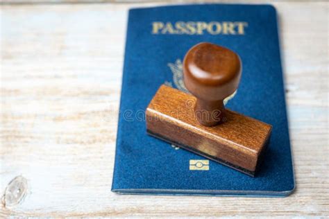 Us Passport And Stamp On Wooden Background Safe Journey With Necessary