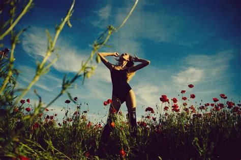 Sexy Girl With A Make Woman Or Girl In Flower Field Of Poppy Seed