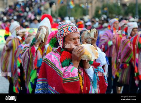 Indigenous Man Blows Conch Shell During Parade On Eve Of Inti Raymi