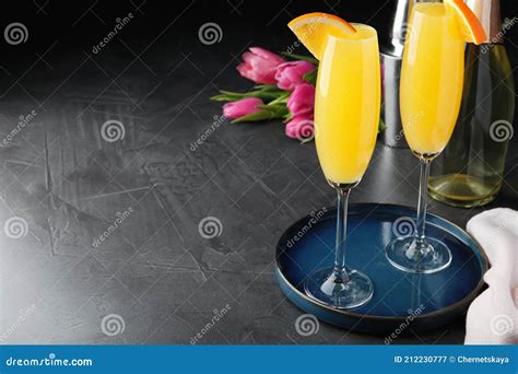 Glasses of Mimosa Cocktail with Garnish on Grey Table. Space for Text Stock Image - Image of ...