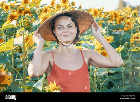 Beautiful Caucasian Woman In Sunflowers Portrait Of A Woman Wearing A