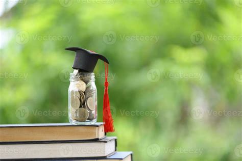 Knowledge And Success Graduation Cap On Books Against A Beautiful