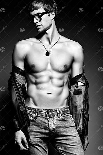 Handsome Muscled Fit Male Model Man Posing In Studio Stock Photo