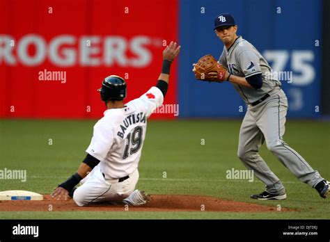 Toronto Blue Jays third baseman Jose Bautista (19) slides into second ...