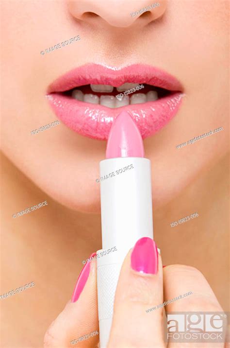 Woman Applying Pink Lipstick Stock Photo Picture And Royalty Free