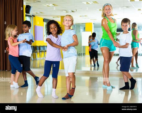 Positive little boys and girls dancing pair dance in the ballet studio Stock Photo - Alamy