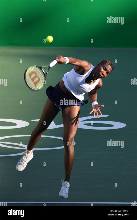 Venus Williams of the United States serves during the Mixed Doubles ...