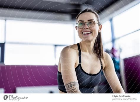 Portrait of a athletic young woman in a gym - a Royalty Free Stock Photo from Photocase