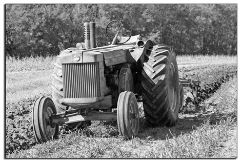 John Deere Tractor Plowing Field