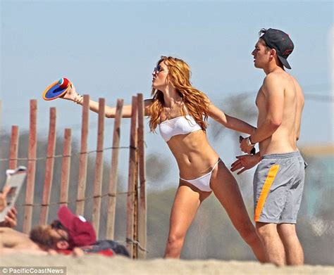 Bella Thorne Dons A White Bikini As She Dips In The Ocean With Gregg