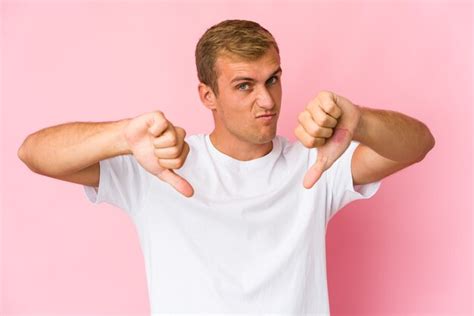 Premium Photo Young Caucasian Handsome Man Showing Thumb Down