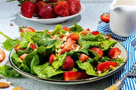 Premium Photo | Strawberry spinach and nuts salad