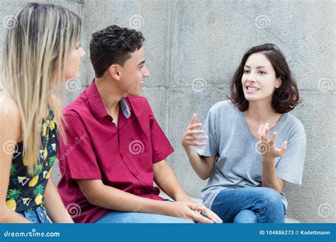 Three Caucasian Young Adults In Discussion Stock Image Image Of Happy