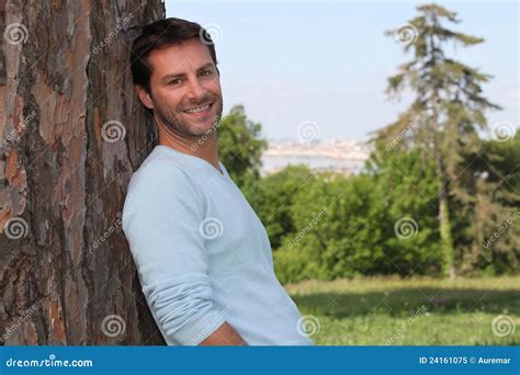 Man Leaning Against A Tree Stock Image Image Of Portrait 24161075