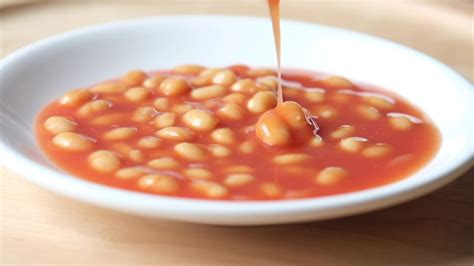 Tasty baked beans in a bowl on table 24972291 Stock Video at Vecteezy