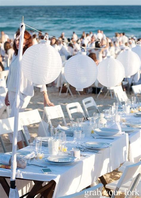 Tables And Chairs Set Up On The Beach For An Event