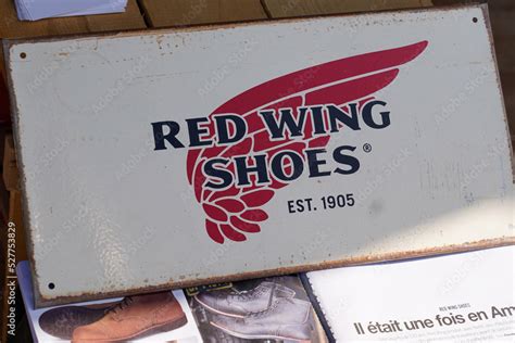 red wing shoes logo sign and brand text on store facade clothing shop ...