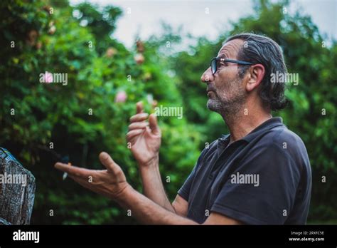 Amidst nature's beauty, a lively Serbian senior, 60 years young, with ...