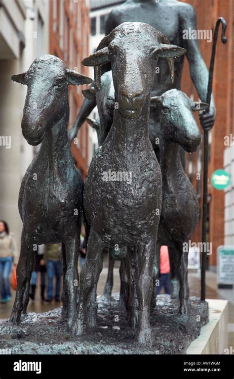 A Statue Of A Sheperd And A Flock Of Sheep In Paternoster Square In