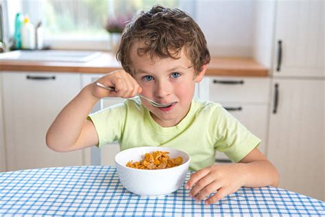 Best Kids Eating Cereal Stock Photos, Pictures & Royalty-Free Images ...