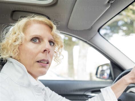 Portrait Of Mature Woman Driving Car Stock Photo