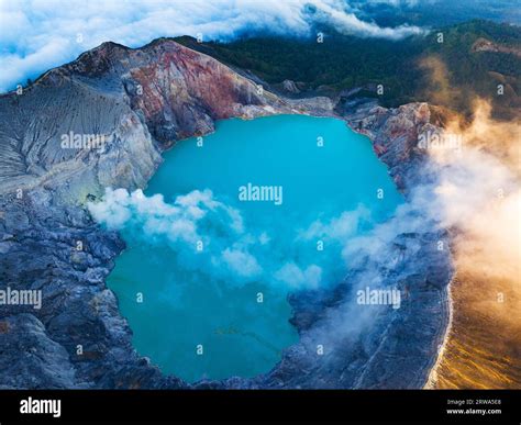 Aerial View Of Rock Cliff At Kawah Ijen Volcano With Turquoise Sulfur