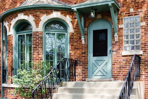 A brightly colored front door is the best way to add a little extra curb appeal to a brick home.