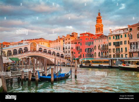 Classic Panoramic View With Traditional Gondolas On Famous Canal Grande